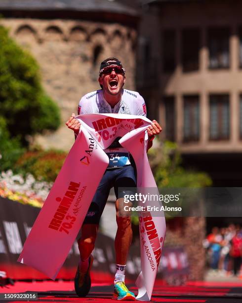 Jan Frodeno of Germany celebrates winning the men's IRONMAN 70.3 Andorra on July 02, 2023 in Andorra la Vella, Andorra.