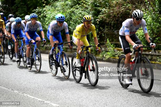 Adam Yates of United Kingdom and UAE Team Emirates - Yellow leader jersey and Tadej Pogacar of Slovenia and UAE Team Emirates - White best young...