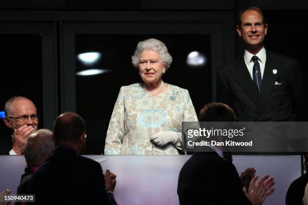 Queen Elizabeth II and Prince Edward, Earl of Wessex look on during the Opening Ceremony of the London 2012 Paralympics at the Olympic Stadium on...
