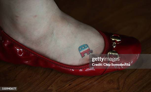 Brittany Edwards of West Memphis, Arkansas shows off her GOP logo tattoo on her foot that she's had for five years during the third day of the...