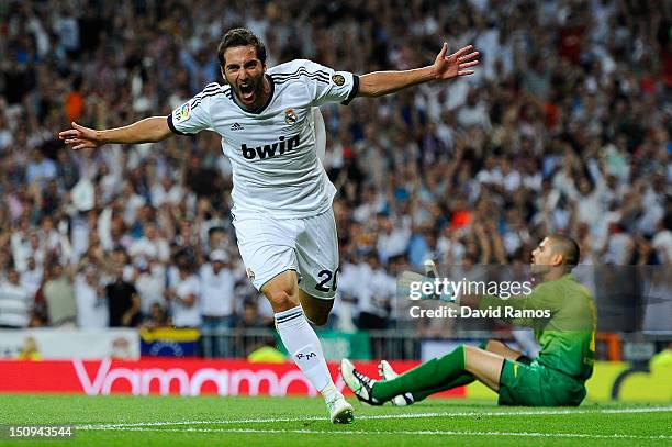 Gonzalo Higuain of Real Madrid CF celebrates after scoring the opening goal during the Super Cup second leg match betwen Real Madrid and FC Barcelona...