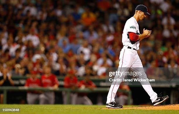 Clayton Mortensen of the Boston Red Sox takes a moment in between pitches after giving up the lead in the third inning against the Los Angeles Angels...