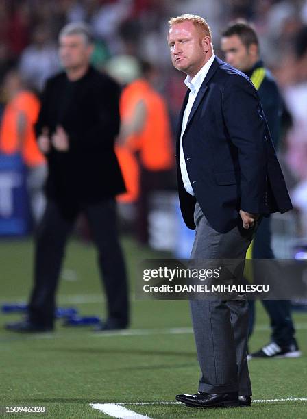 Basel's coach Heiko Vogel reacts during their UEFA Champions League play-off second-leg football match against CFR Cluj 1907 in Cluj-Napoca city on...