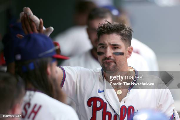 Nick Castellanos of the Philadelphia Phillies reacts with teammates after hitting a solo home run during the first inning against the Washington...