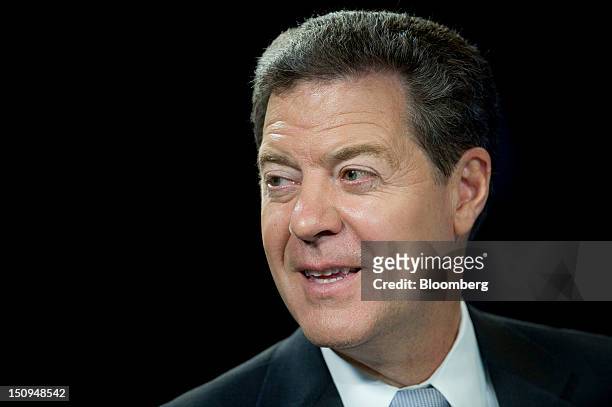 Sam Brownback, governor of Kansas, speaks during a Bloomberg Television interview inside the Bloomberg Link during the Republican National Convention...