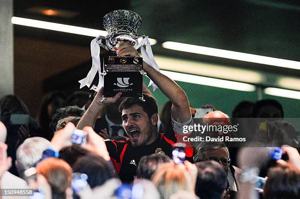 Iker Casillas of Real Madrid CF holds up the trophy after defeating FC Barcelona during the Super Cup second leg match betwen Real Madrid and FC...