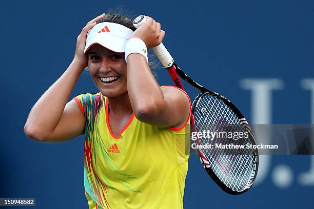 Laura Robson of Great Britain celebrates match point against Kim Clijsters of Belgium after their women's singles second round match on Day Three of...