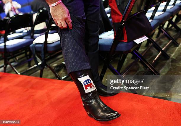 Man shows off the GOP logo on his cowboy boot during the third day of the Republican National Convention at the Tampa Bay Times Forum on August 29,...