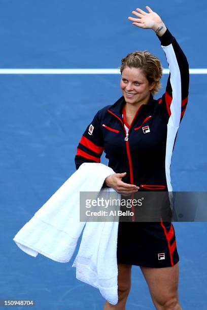 Kim Clijsters of Belgium waves to the crowd before walking off court following her defeat to Laura Robson of Great Britain after their women's...