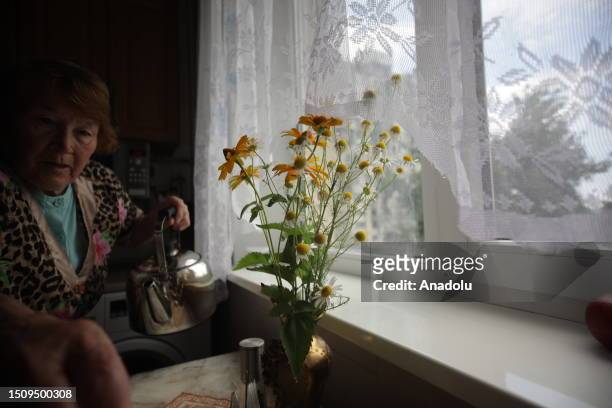 Year-old Natasha prepares coffee at her destroyed house in Kharkiv, Ukraine on July 06, 2023. She lives in front of the destroyed building, was also...