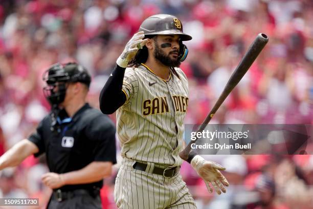 Fernando Tatis Jr. #23 of the San Diego Padres reacts after striking out in the third inning against the Cincinnati Reds at Great American Ball Park...