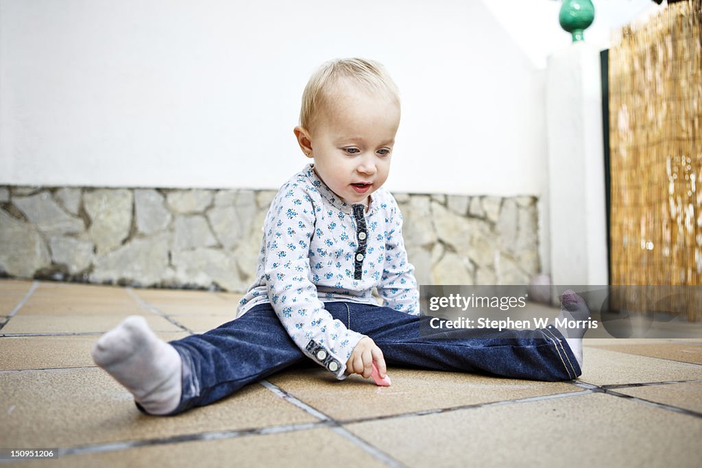 Young Child Drawing on Floor