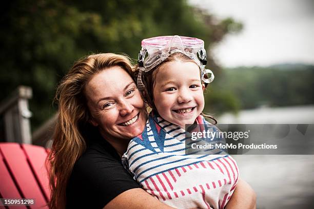 mother and daughter at lake - portrait - mother daughter towel fotografías e imágenes de stock