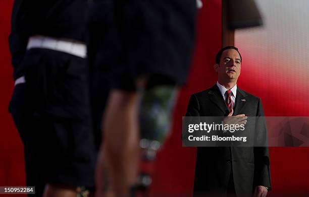 Reince Priebus, chairman of the Republican National Committee, recites the pledge of allegiance at the Republican National Convention in Tampa,...