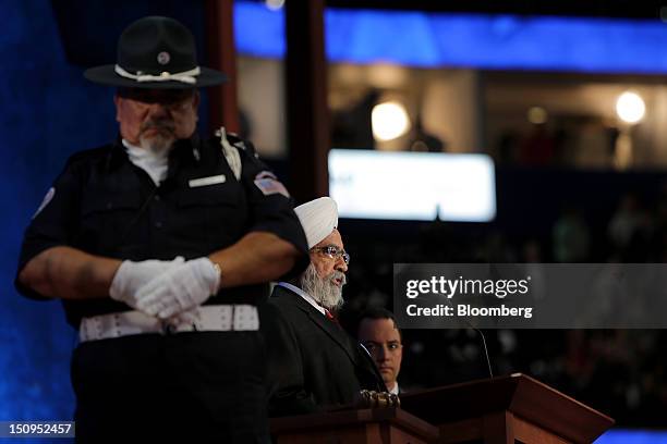 Ishwar Singh, head of the Sikh Society of Central Florida, center, speaks while Reince Priebus, chairman of the Republican National Committee, right,...