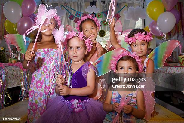 little girls at a birthday party - feenkostüm stock-fotos und bilder