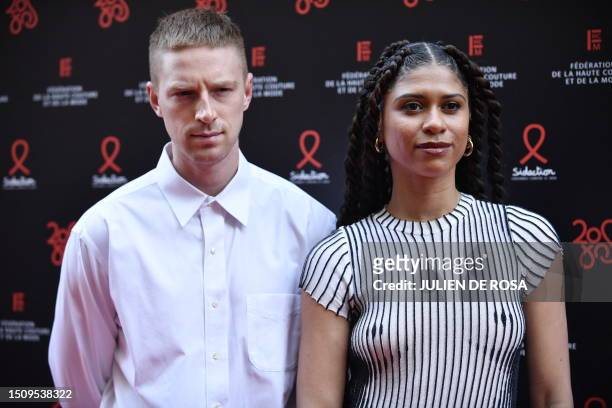 Fencer Race Imboden and French fencer Ysaora Thibus pose for a photocall at a charity fashion dinner "Diner de la Mode" in profit of the French...