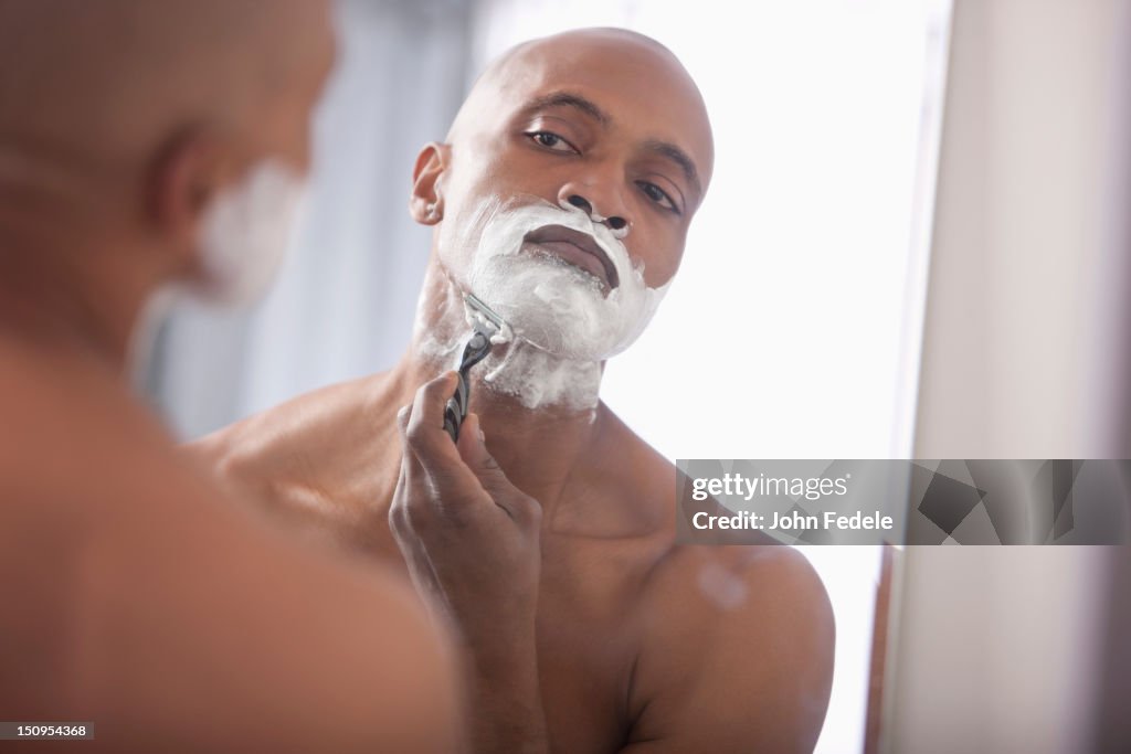 Black man shaving