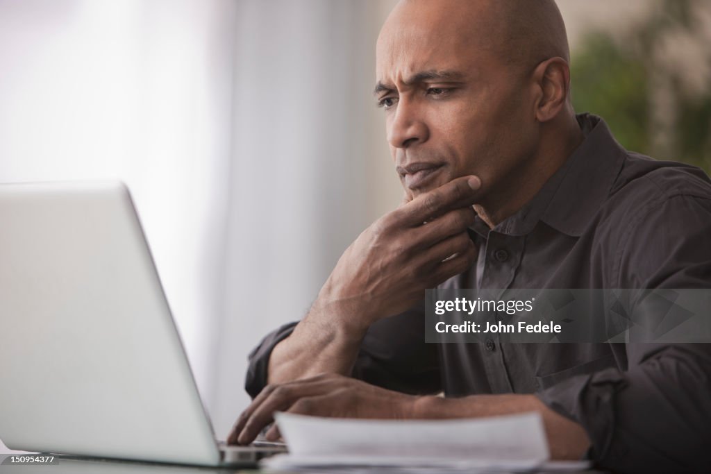 Black man using laptop