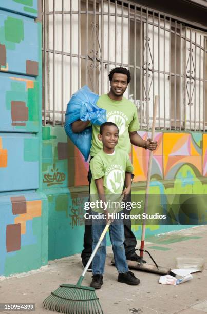 Black Man Picking Up Trash In Own Yard Black Man Picking Up Trash Photos and Premium High Res Pictures - Getty