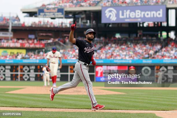 Jeimer Candelario of the Washington Nationals rounds bases after hitting a solo home run during the fifth inning against the Philadelphia Phillies at...