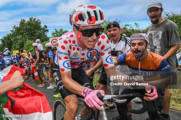 Neilson Powless of The United States and Team EF Education-EasyPost - Polka Dot Mountain Jersey competes in the breakaway while fans cheer during the...