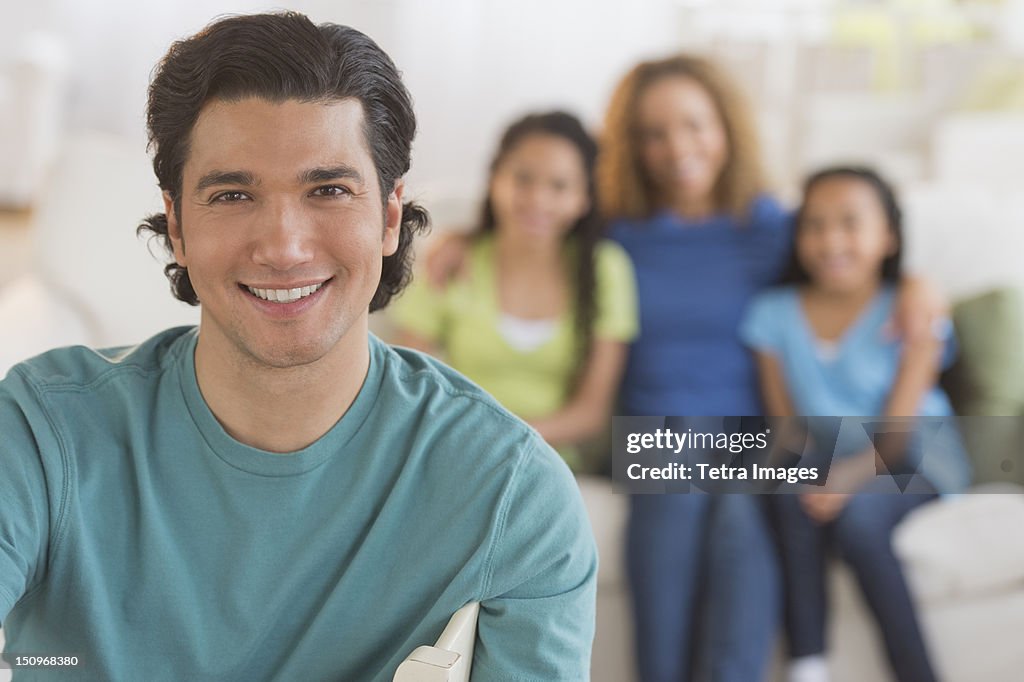 USA, New Jersey, Jersey City, Portrait of man with wife and daughters (10-13) in background