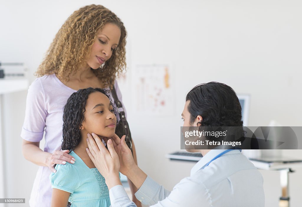 USA, New Jersey, Jersey City, Mother with daughter (12-13) visiting pediatrician