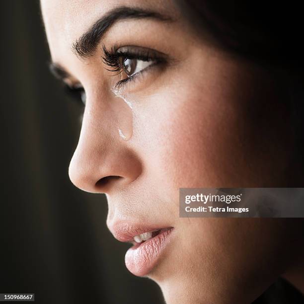 close-up of young woman crying - tear face photos et images de collection