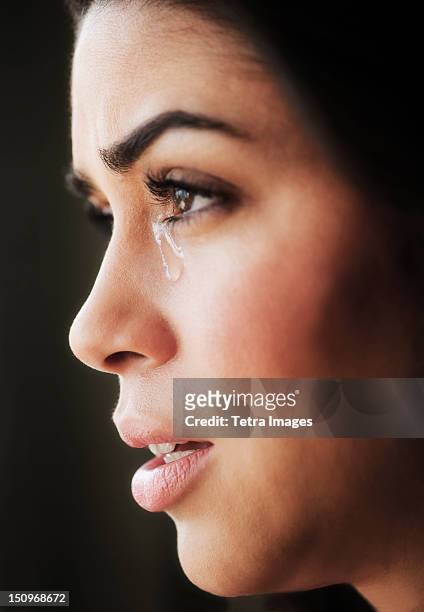 close-up of young woman crying - teardrop stock pictures, royalty-free photos & images
