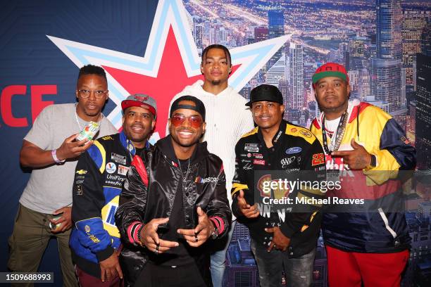 Lupe Fiasco, Lahmard Tate, Larenz Tate, Larron Tate, Twista and in the rear, Justin Fields, quarterback of the Chicago Bears pose for photos at the...