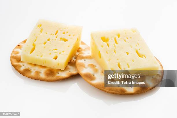 pyrennes cow cheese with crackers - crackers stock pictures, royalty-free photos & images
