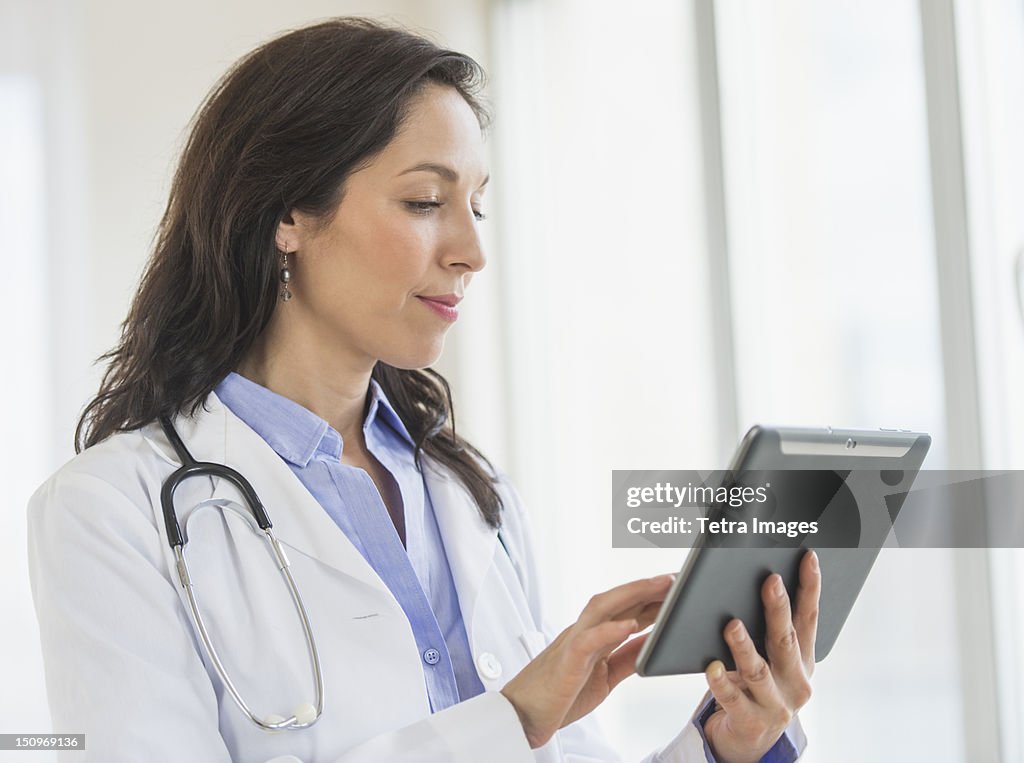 USA, New Jersey, Jersey City, Female doctor using digital tablet