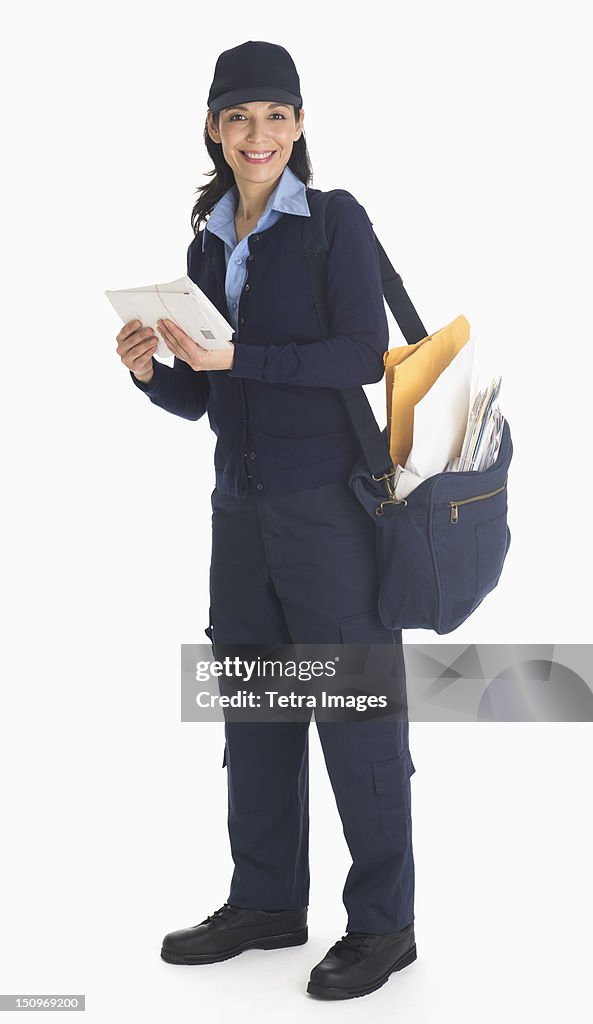 Studio shot of female postal worker