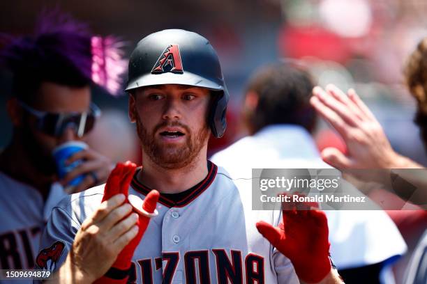 Carson Kelly of the Arizona Diamondbacks celebrates a home run against the Los Angeles Angels in the second inning at Angel Stadium of Anaheim on...