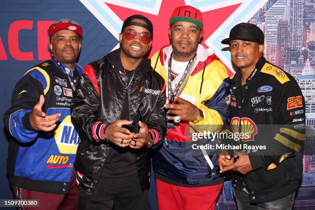 Lahmard Tate, Larenz Tate, Twista and Larron Tate pose for photo at the drivers meeting in the Chicago Stock Exchange Trading Room at the Art...