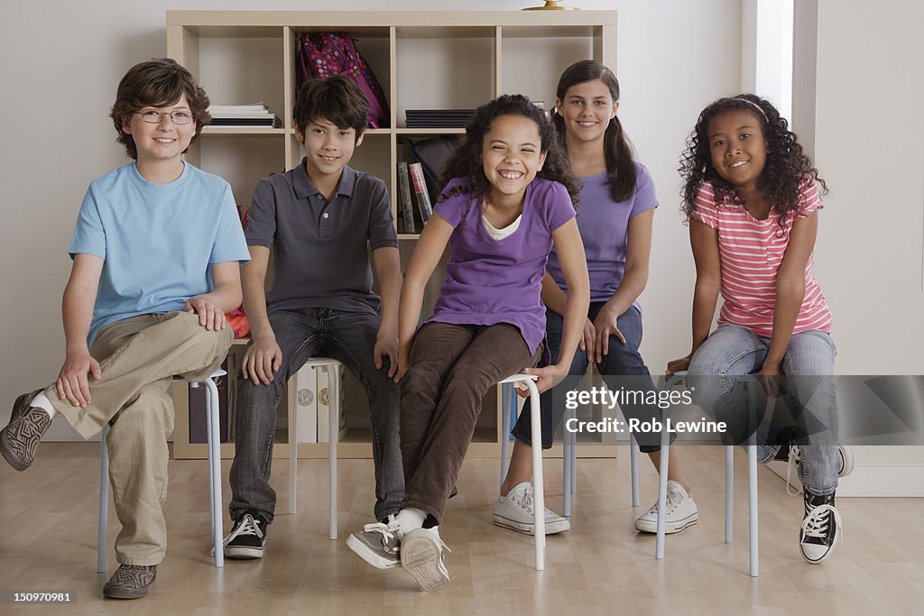 USA, California, Los Angeles, portrait of grinning pupils sitting in classroom