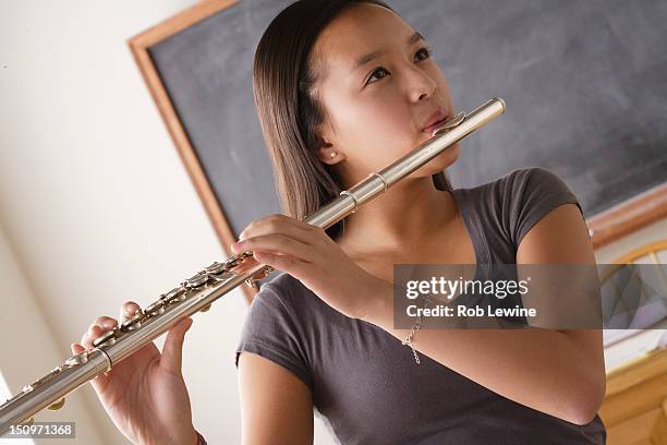 usa, california, los angeles, teenage girl (14-15) playing flute - flauta imagens e fotografias de stock
