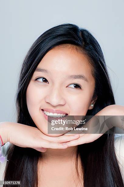 portrait of teenage girl (14-15), studio shot - sideways glance stock pictures, royalty-free photos & images