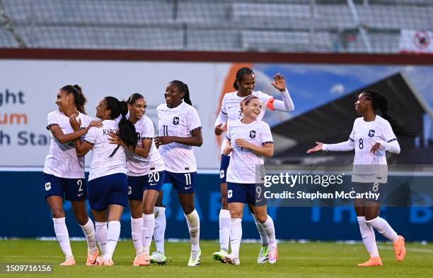 Dublin , Ireland - 6 July 2023; Maelle Lakrar of France, left, celebrates with teammates after scoring her side's third goal during the women's...