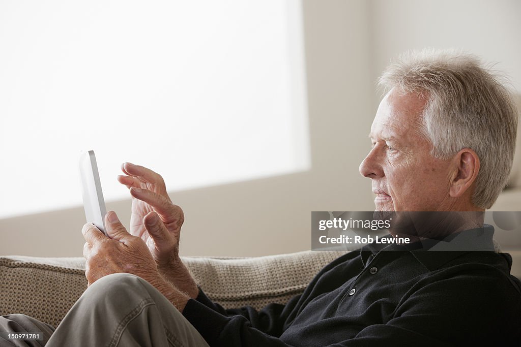 USA, California, Los Angeles, Senior man using digital tablet