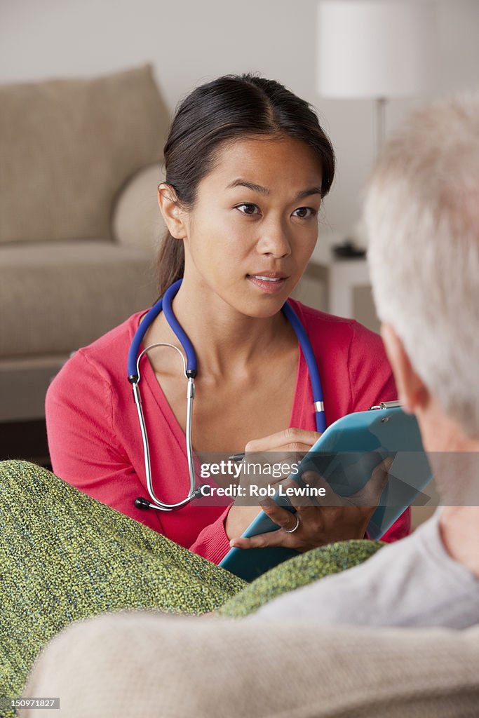 USA, California, Los Angeles, Female nurse with senior patient at home