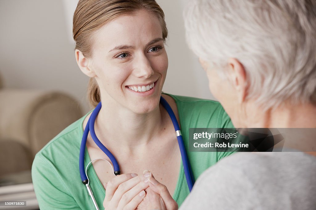 USA, California, Los Angeles, Female nurse with senior patient at home