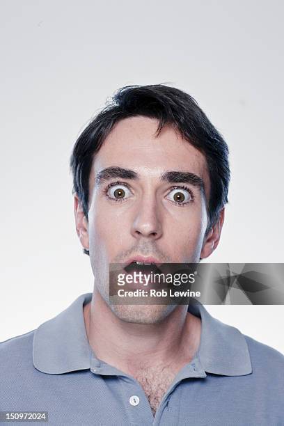 portrait of scared man, studio shot - terrified stock pictures, royalty-free photos & images