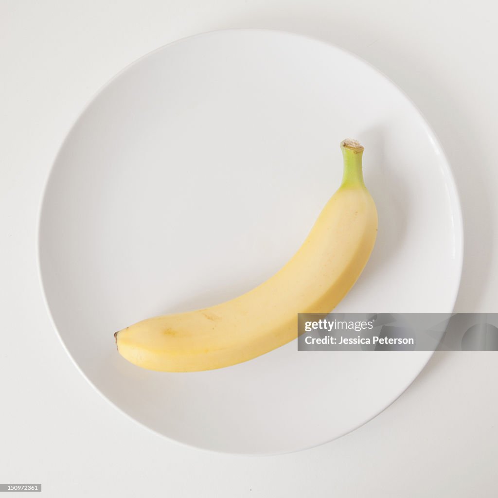 Banana on plate, studio shot