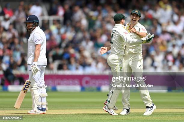 Pat Cummins of Australia and Alex Carey of Australia celebrates the wicket of Jonny Bairstow of England during Day Five of the LV= Insurance Ashes...