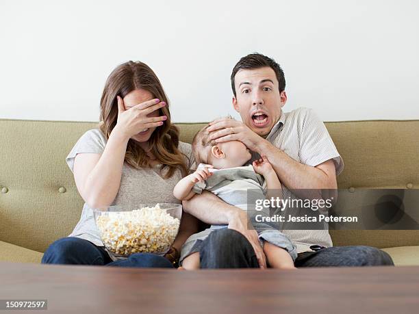usa, utah, salt lake city, young couple with baby boy (6-11 months) watching horror film - horror movie ストックフォトと画像
