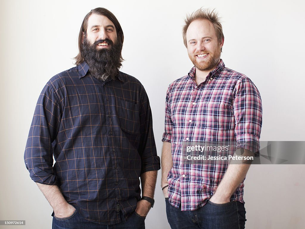 Two bearded males posing together