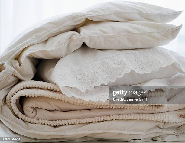 folded bedding - bedding foto e immagini stock