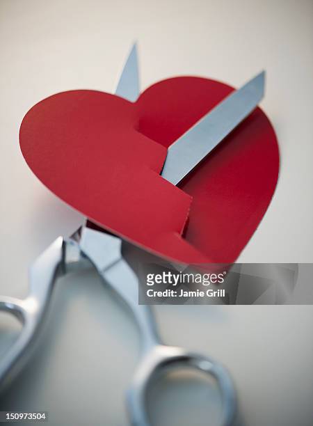 Scissors Cutting Paper Heart High-Res Stock Photo - Getty Images